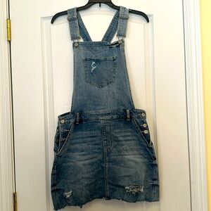 CELEBRITY PINK FADED DENIM OVERALL MINI. FRAYED EDGES AND HOLES. SIZE MEDIUM.